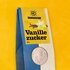 Sonnentor organic vanilla sugar in paper packaging with viewing window, vanilla pods, vanilla flower and note "new grind"
