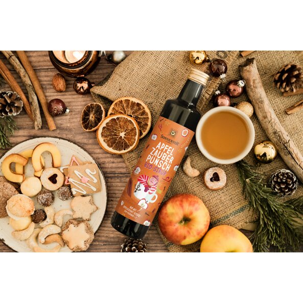 Sonnentor organic apple magic punch syrup with cookies, spices, and a cup of apple punch