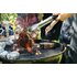 In the photo you can see two steaks being grilled. Behind them at the table are several barbecue spices.