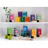 A picture of all Happiness Is tea packs. They are on a shelf and are placed on to floors.