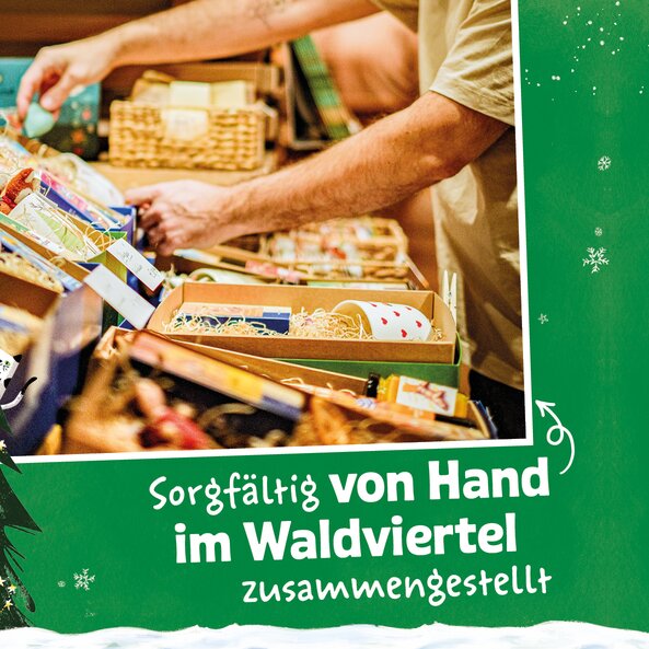 Person assembling gift boxes by hand with text "Carefully assembled by hand in the Waldviertel region"